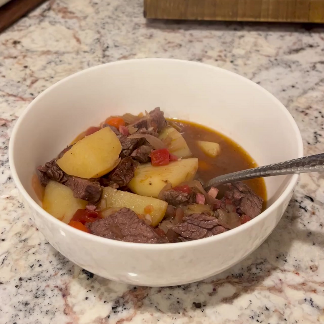 Ina Garten's hearty Beef Stew with carrots and potatoes in a Dutch oven