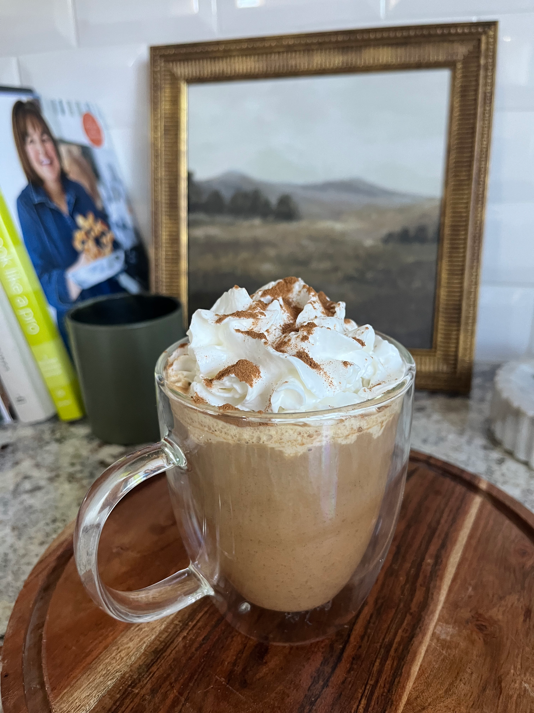 Homemade Pumpkin Spice Latte with whipped cream and cinnamon in a cozy mug
