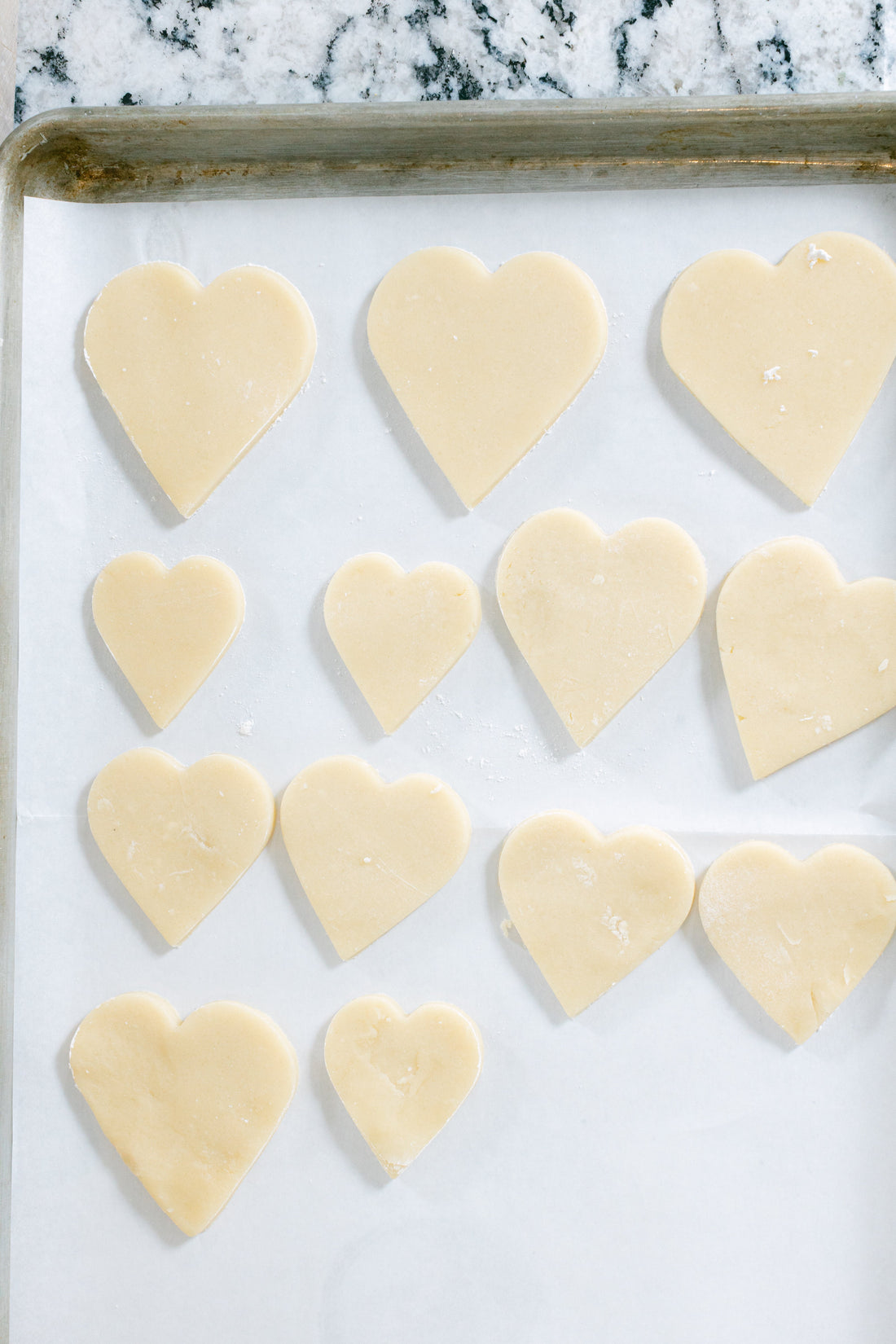 Galentine's Day cookie decorating party with colorful frosted cookies and friends