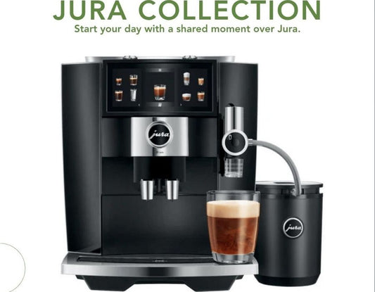 Jura automatic coffee maker brewing artisan coffee at home on a kitchen counter