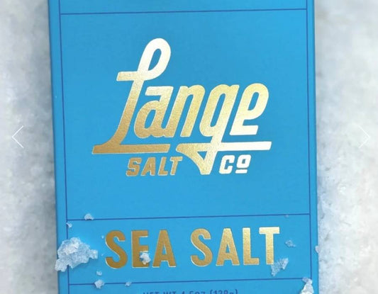 Lange Salt artisan sea salt in a bowl with a wooden spoon on a kitchen surface
