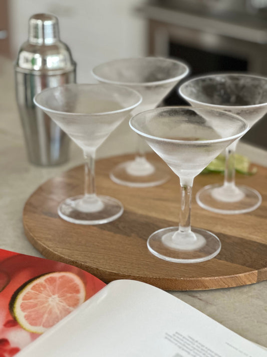 Ina Garten's Pomegranate Spritzers in tall glasses with pomegranate seeds and mint