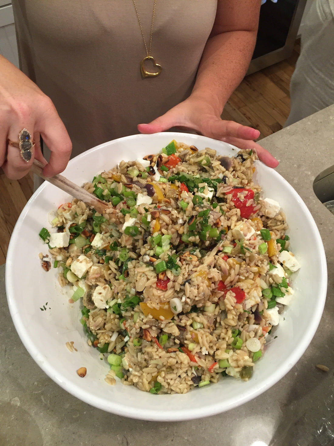 Colorful orzo pasta salad with feta, peppers, and vegetables in a large white bowl, Barefoot Contessa BBQ side