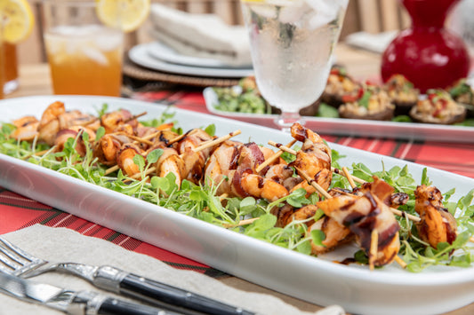 Bacon Wrapped Shrimp on a serving platter with dipping sauce