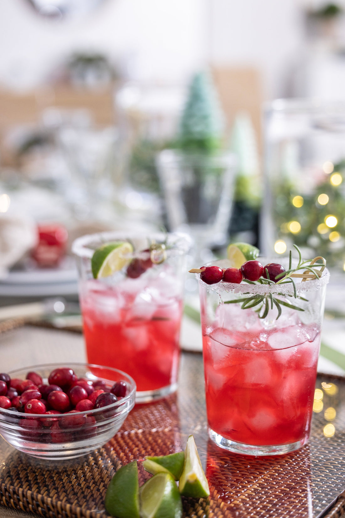 Cassandra's Rosemary Cranberry Margaritas garnished with fresh rosemary sprigs and cranberries