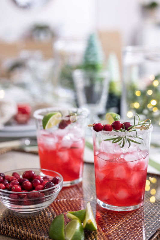 Cassandra's Rosemary Cranberry Margaritas garnished with fresh rosemary sprigs and cranberries