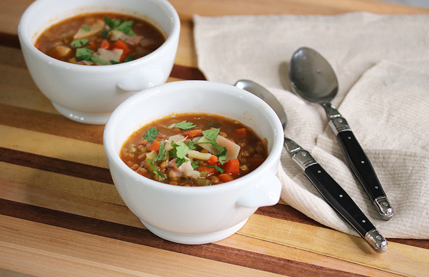 Ina Garten's hearty Lentil Vegetable Soup in a Dutch oven