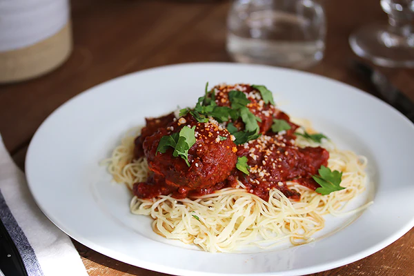 Ina Garten's Spaghetti and Meatballs with tomato sauce and fresh basil