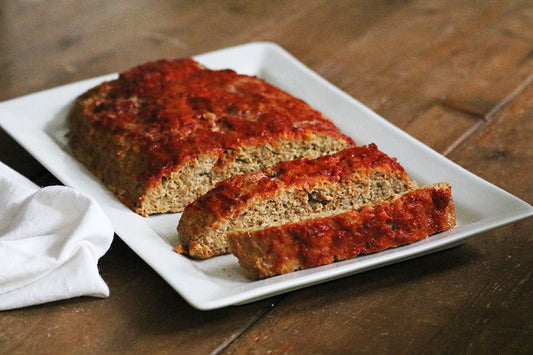 Ina Garten's classic Meatloaf with tomato glaze on a serving platter