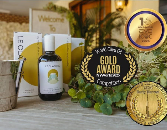 Le Clarisse extra virgin olive oil from Umbria, Italy — artisan olive oil bottle on a kitchen counter