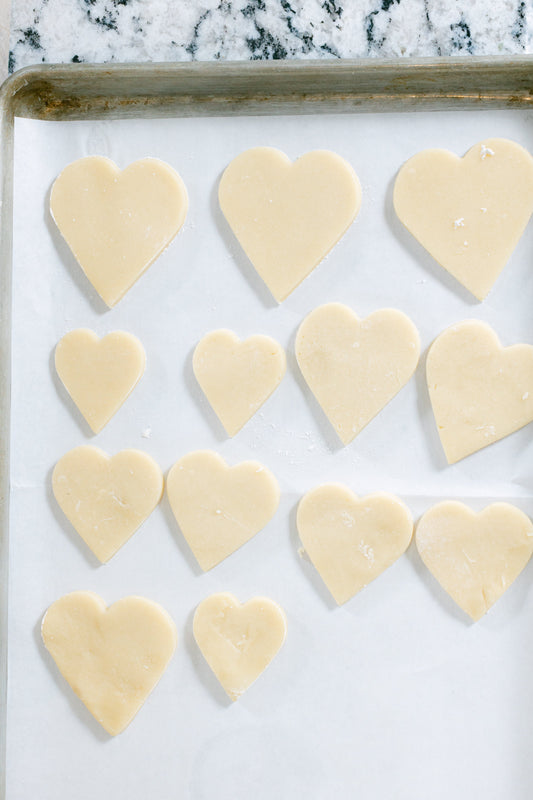 Galentine's Day cookie decorating party with colorful frosted cookies and friends