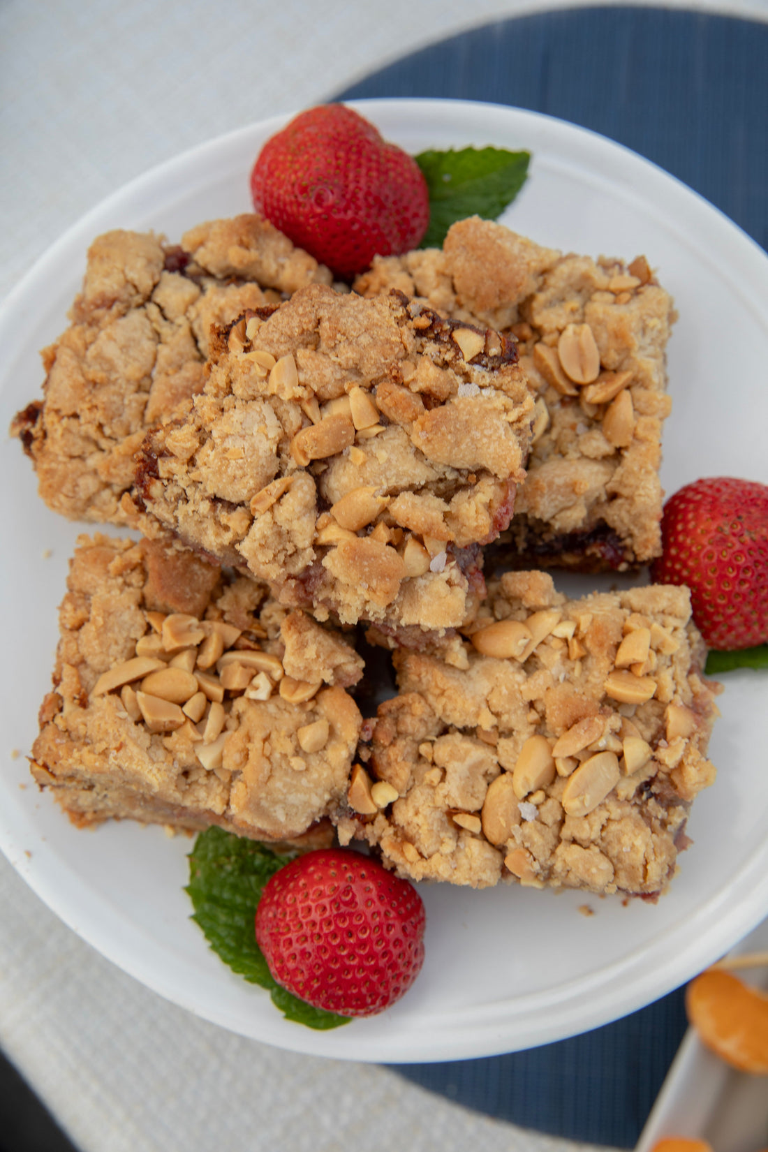 Ina Garten's Peanut Butter and Jelly Bars cut into squares on a baking sheet