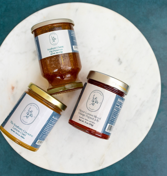 Southern Conserve Meyer Lemon Blood Orange Pepper Jelly jar with vibrant citrus color