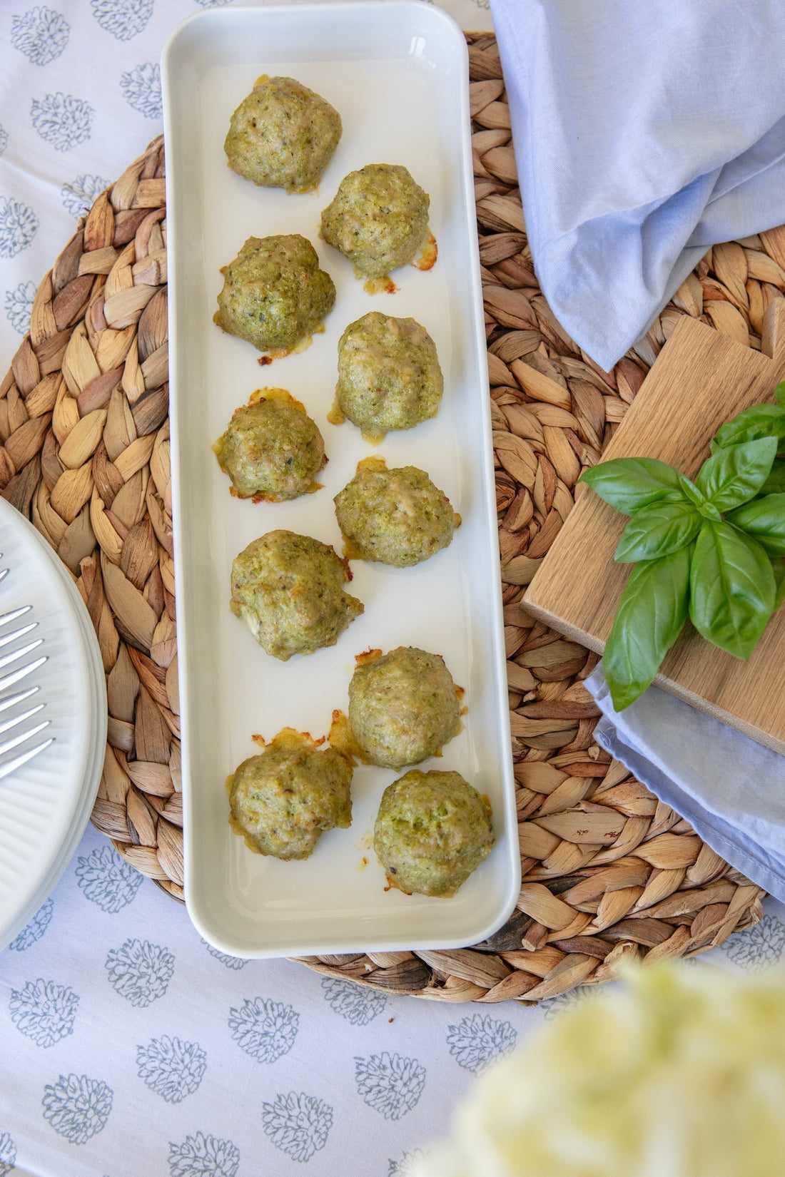 Grossy Pelosi's Chicken Pesto Meatballs in tomato sauce with fresh basil