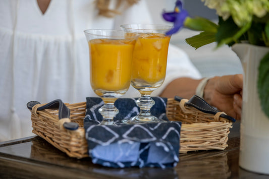 Ina Garten's Mango Daiquiri cocktails in glasses garnished with fresh lime and mango