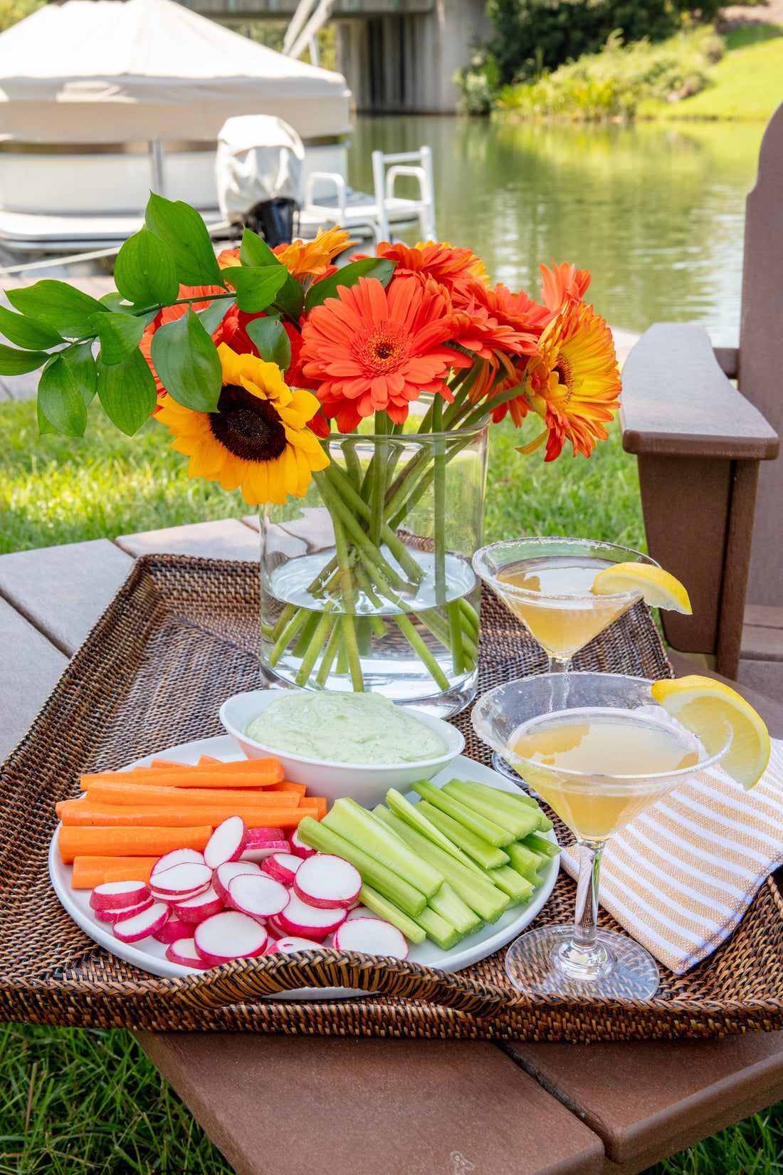 Lidey's creamy Feta, Avocado, and Herb Dip with colorful crudités and pita chips
