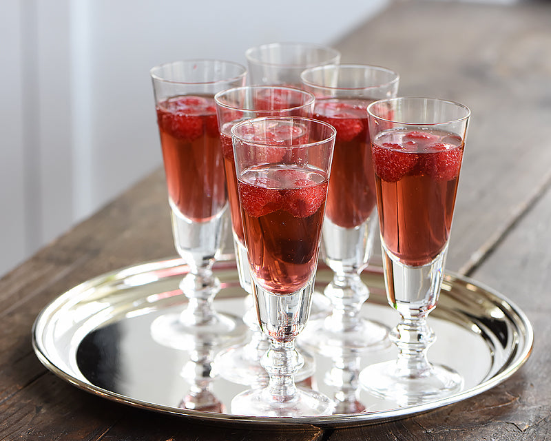 6 La Rochere Antoine Champagne Flutes with red cocktail garnished with raspberries