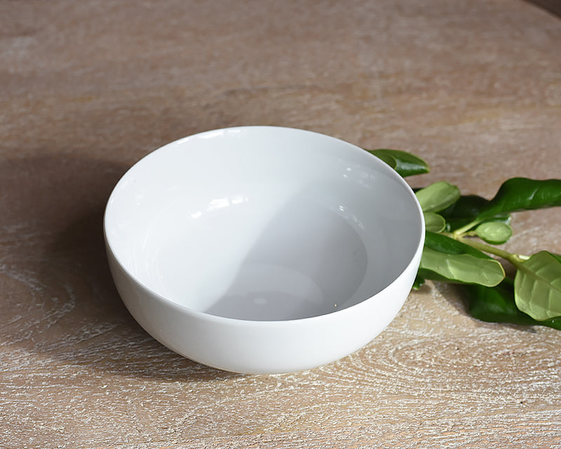 White Pillivuyt Cereal Bowl next to greenery