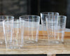5 rippled farmhouse glasses on wooden table