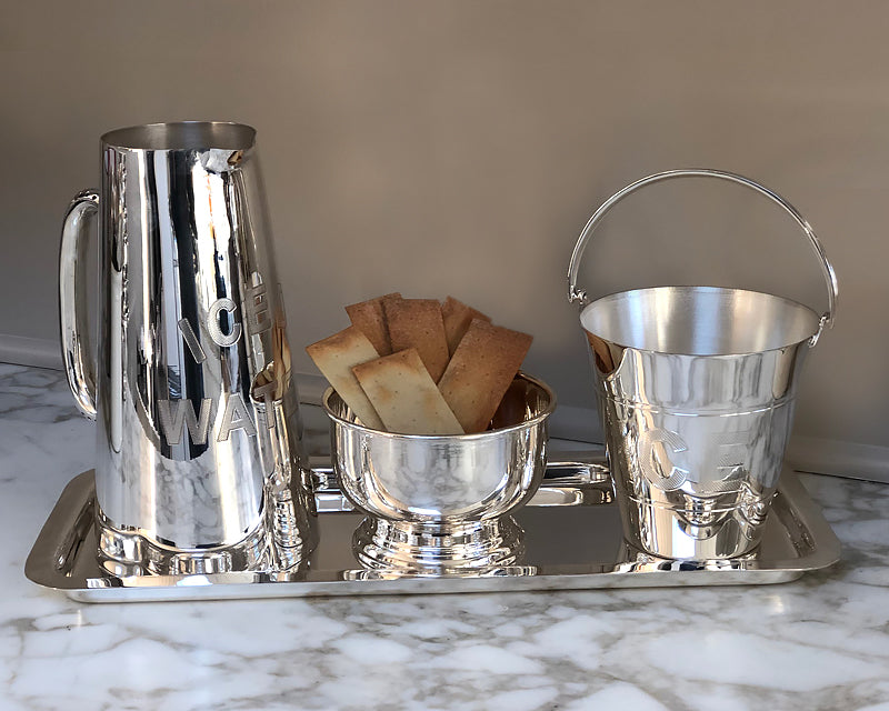Silver cold drink pitcher, ice pail, and pedestal bowl from the HÔTEL Silver collection 