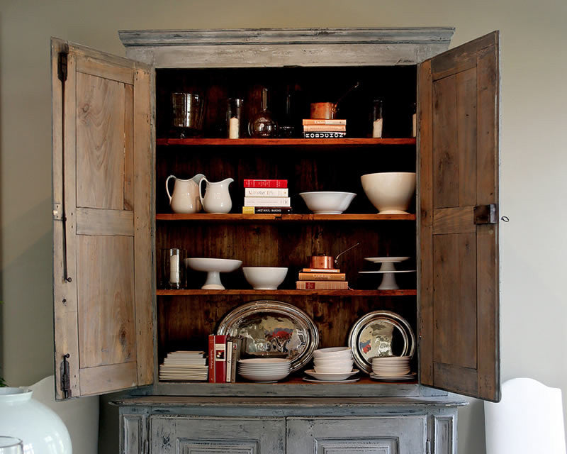 Ina Garten's cupboard filled with Hotel Silver and white ceramic serving pieces. Many of them available at Cassandra's Kitchen. Image: Béatrice de Géa for The New York Times