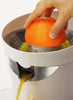 an orange being juiced by an All-Citrus Juicer
