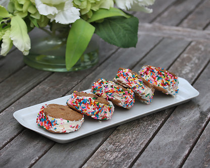 Ice cream sandwiches made with Tates Chocolate Chip Cookies, ice cream and rainbow sprinkles displayed beautifully on the Narrow Platter by Pillivuyt