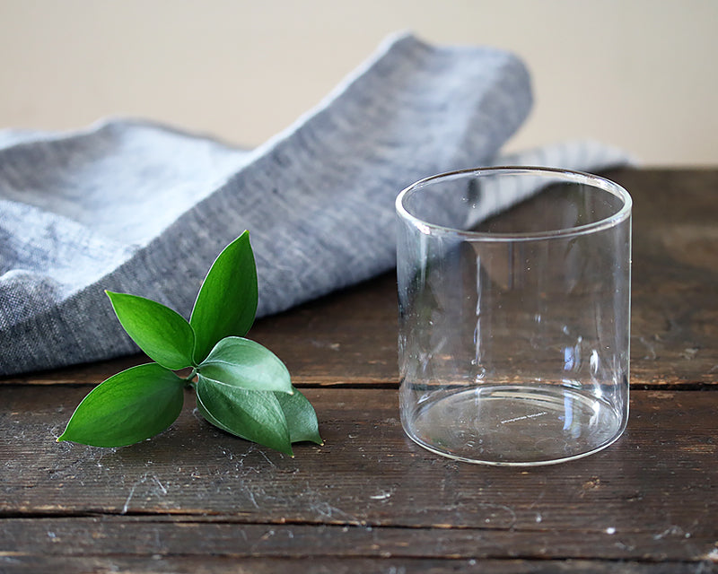 Simple Double Old Fashioned Glass next to an stone washed linen napkin