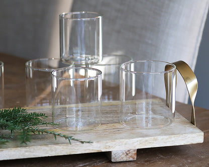 5 simple cocktail glasses on wooden cutting board