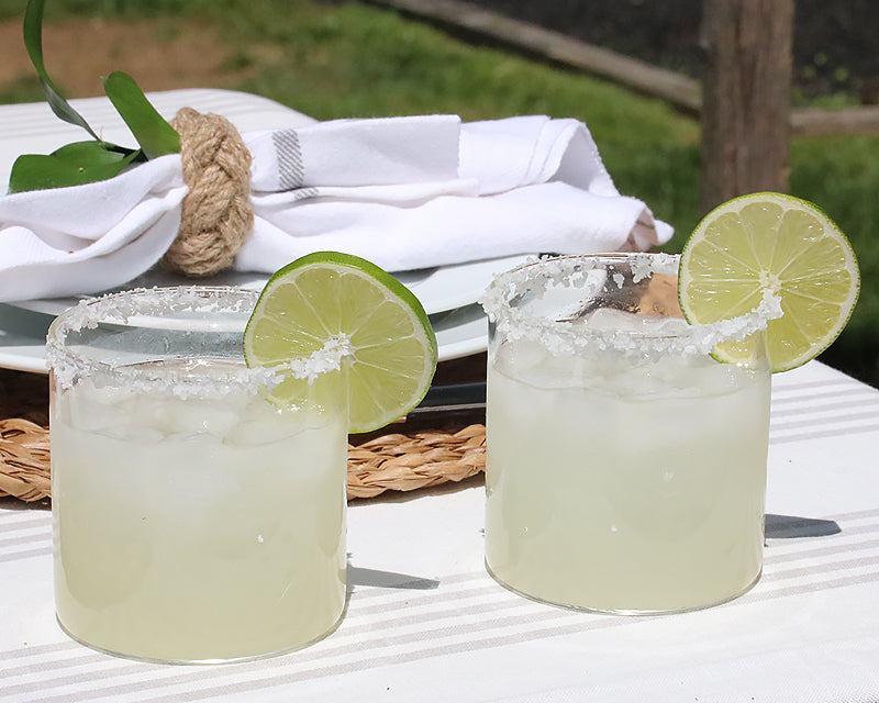 cocktail glasses garnished with lime