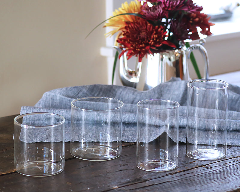 Simple Glassware Collection on a dining table next to a fall bouquet of flowers
