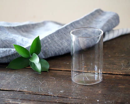 Simple Juice Glass and a linen napkin on a wood table